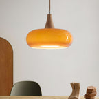 Candeeiro suspenso Eloria em vidro âmbar, topo de madeira, conjunto de 1–3 lâmpadas