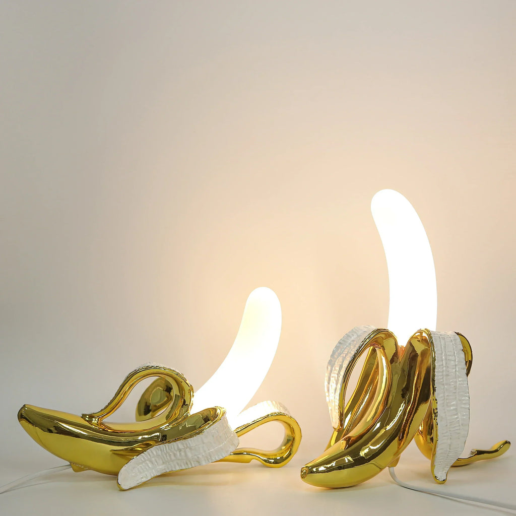 Fantazyjna lampka stołowa w kształcie banana z żywicy w ciepłych odcieniach, BananaShine
