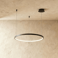 Aurora Circle Chandelier With Soft Halo Lighting Above Dining