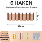 Dřevěný nástěnný věšák s řadou háčků ve tvaru kláves piana
