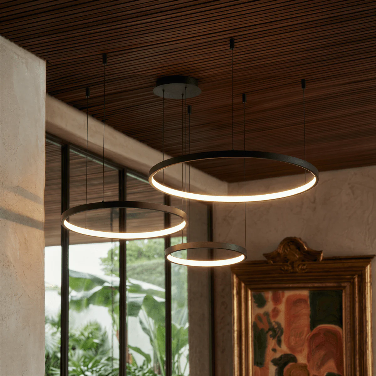 Aurora Circle Chandelier With Soft Halo Lighting Above Dining