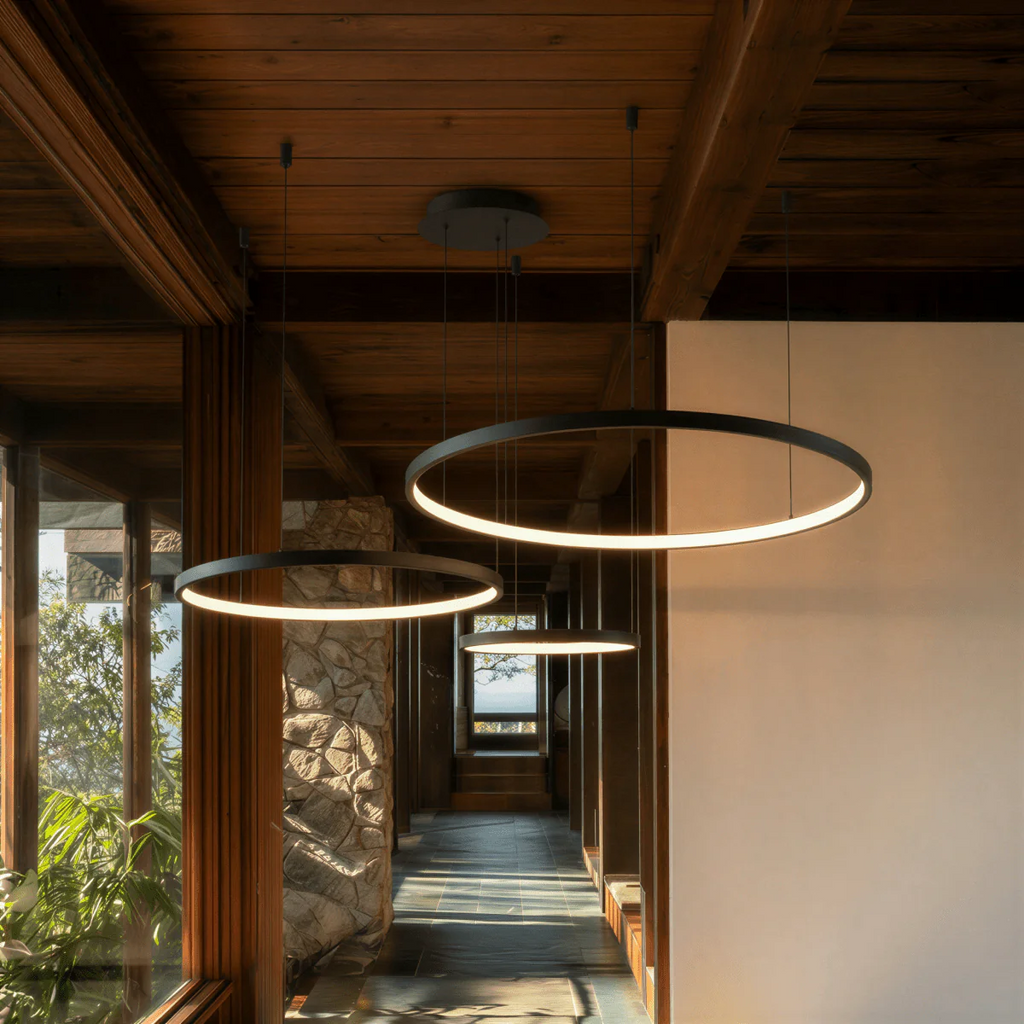 Aurora Circle Chandelier With Soft Halo Lighting Above Dining