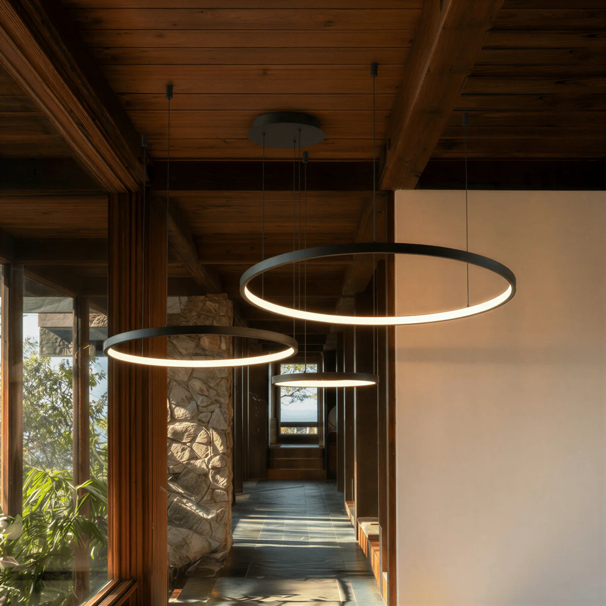 Aurora Circle Chandelier With Soft Halo Lighting Above Dining