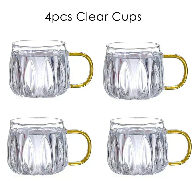 Set med dryckeskanna i glas med lock i rostfritt stål samt matchande koppar