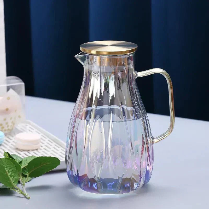 Set med dryckeskanna i glas med lock i rostfritt stål samt matchande koppar